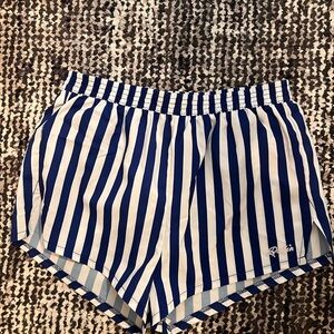 Dolfin shorts in size medium and large with white/blue stripes unused